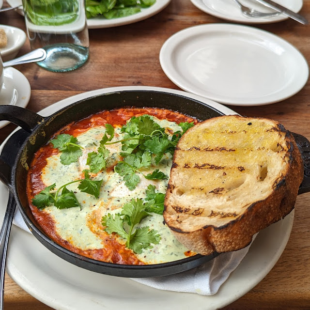 Moroccan Baked Eggs Merguez Tomato Sauce Cilantro Spiced Yogurt