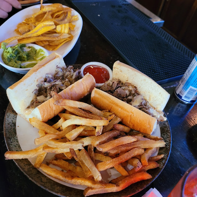 Ribeye Cheesesteak with Onion Mushroom and American Cheese Sauce on a Long Roll