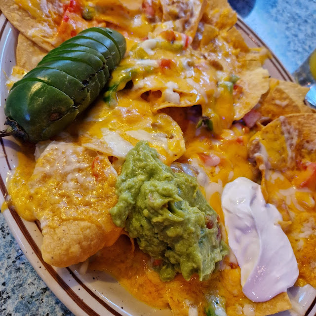 Old Town Nachos with Chips Cheeses Beans Guacamole Sour Cream Jalapeños & Veggies