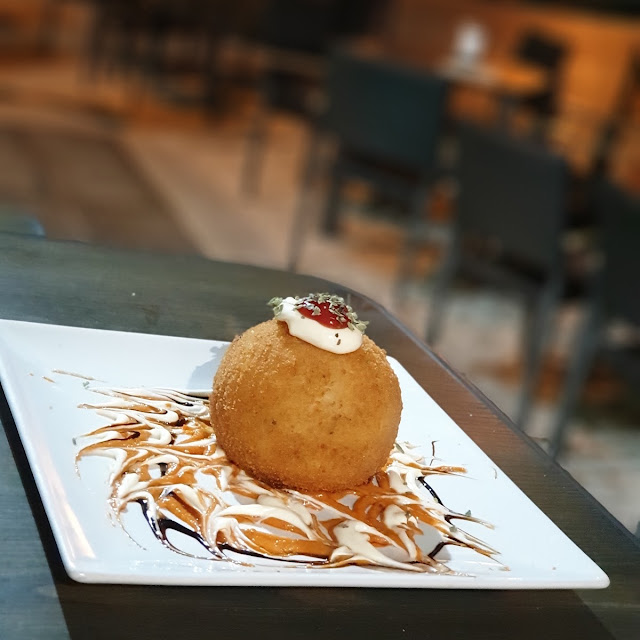 Patata Rellena Con Carne Picante